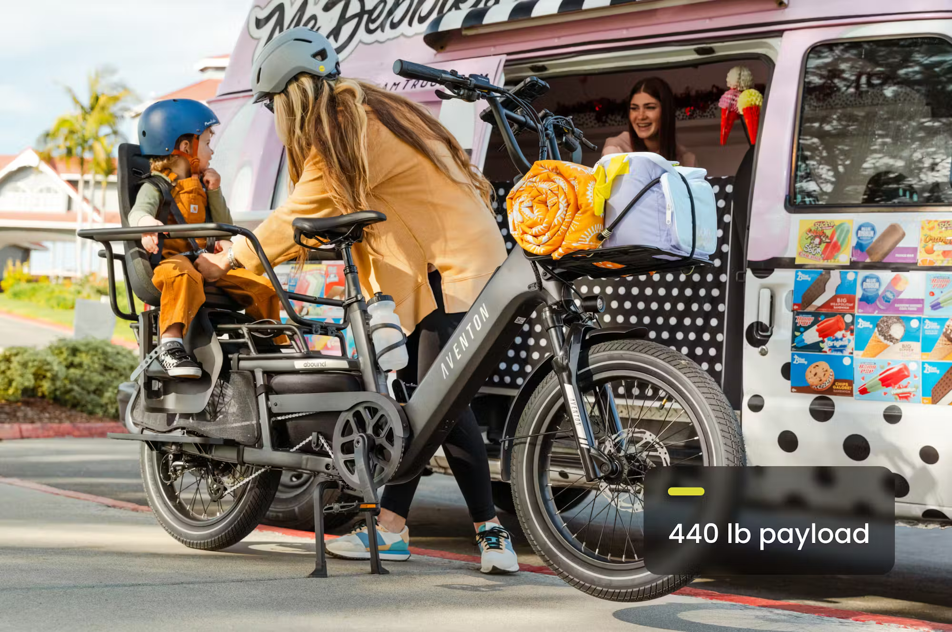 Aventon Abound LR cargo e-bike by Rex E-Bikes carrying a child and cargo with 440 lb payload capacity