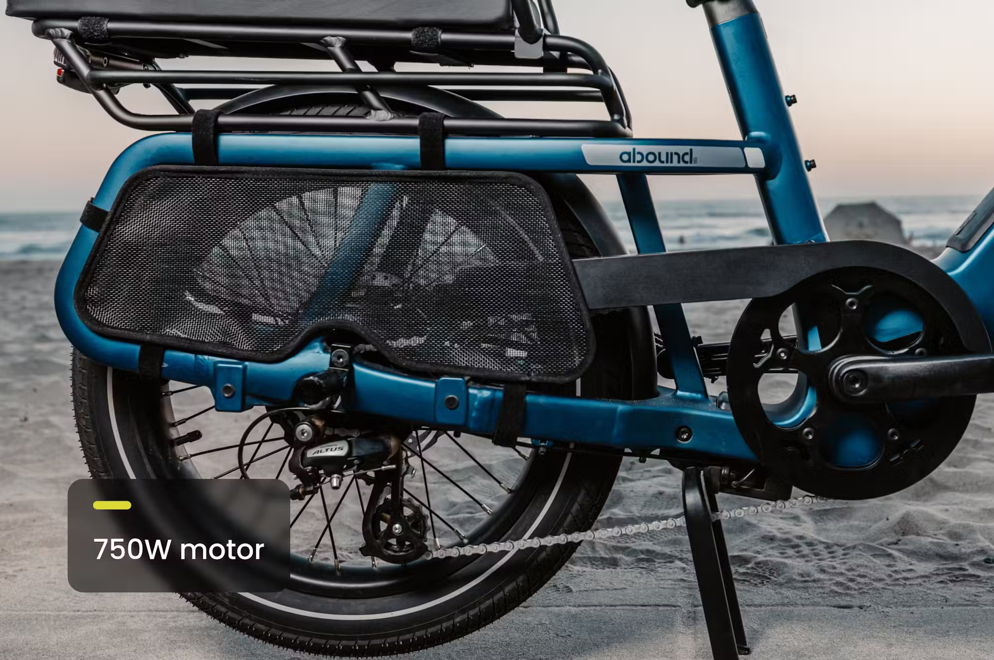 Rear close-up of Rex E-Bikes Aventon Abound SR cargo e-bike showing motor and chain guard in blue