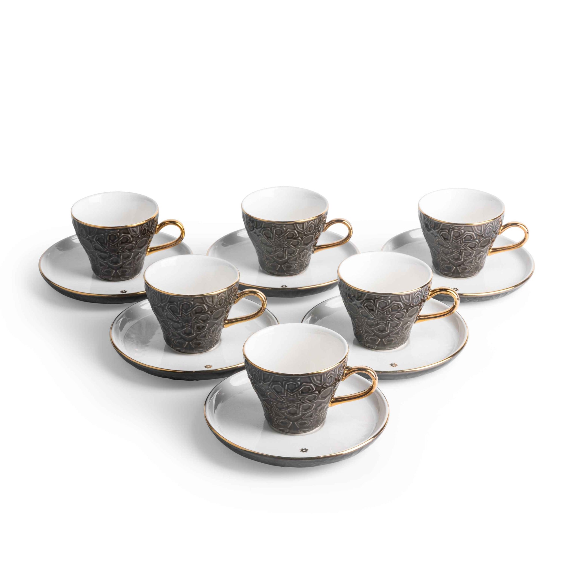 Otantik Home black and gold espresso cup set with textured black cups and gold handles on white saucers