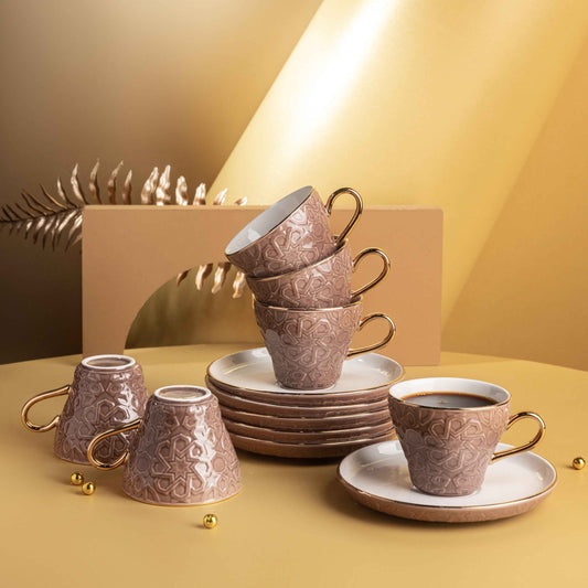 Brown and gold espresso cup set with intricate patterns including six cups and matching saucers