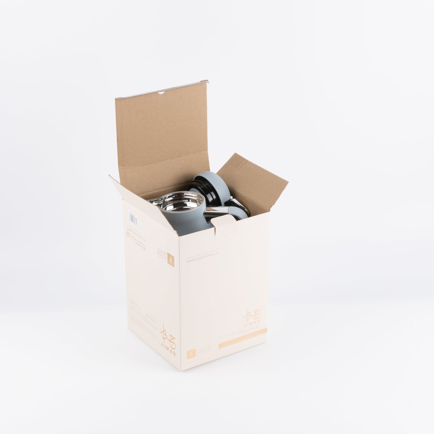 Jiwar vacuum flask haze blue partially visible inside an open cardboard box by Otantik Home