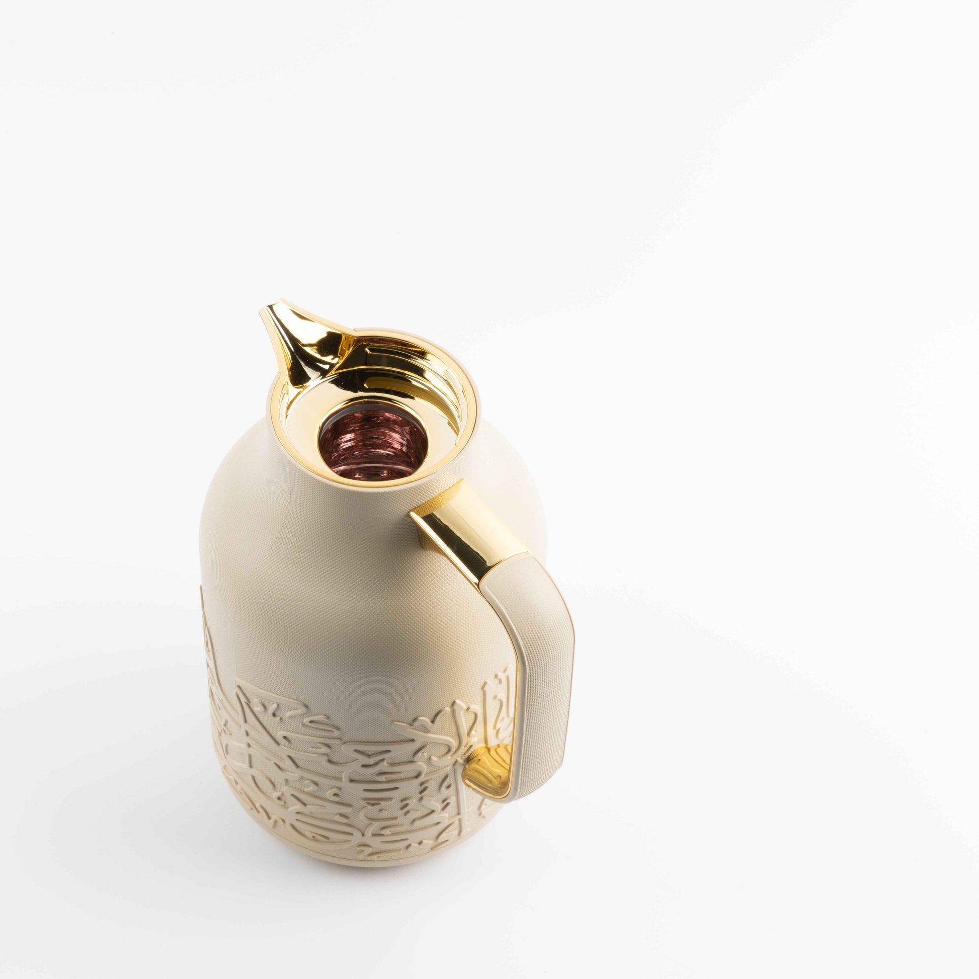 Otantik Home Jiwar vacuum flask with gold accents and a textured cream body design