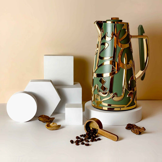 Luxury vacuum flask in green and gold with decorative design and wooden scoop with coffee beans
