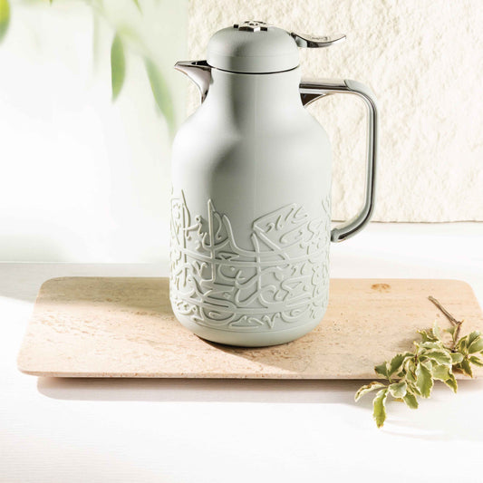 Otantik Home mint green vacuum flask with Arabic calligraphy design on wooden tray