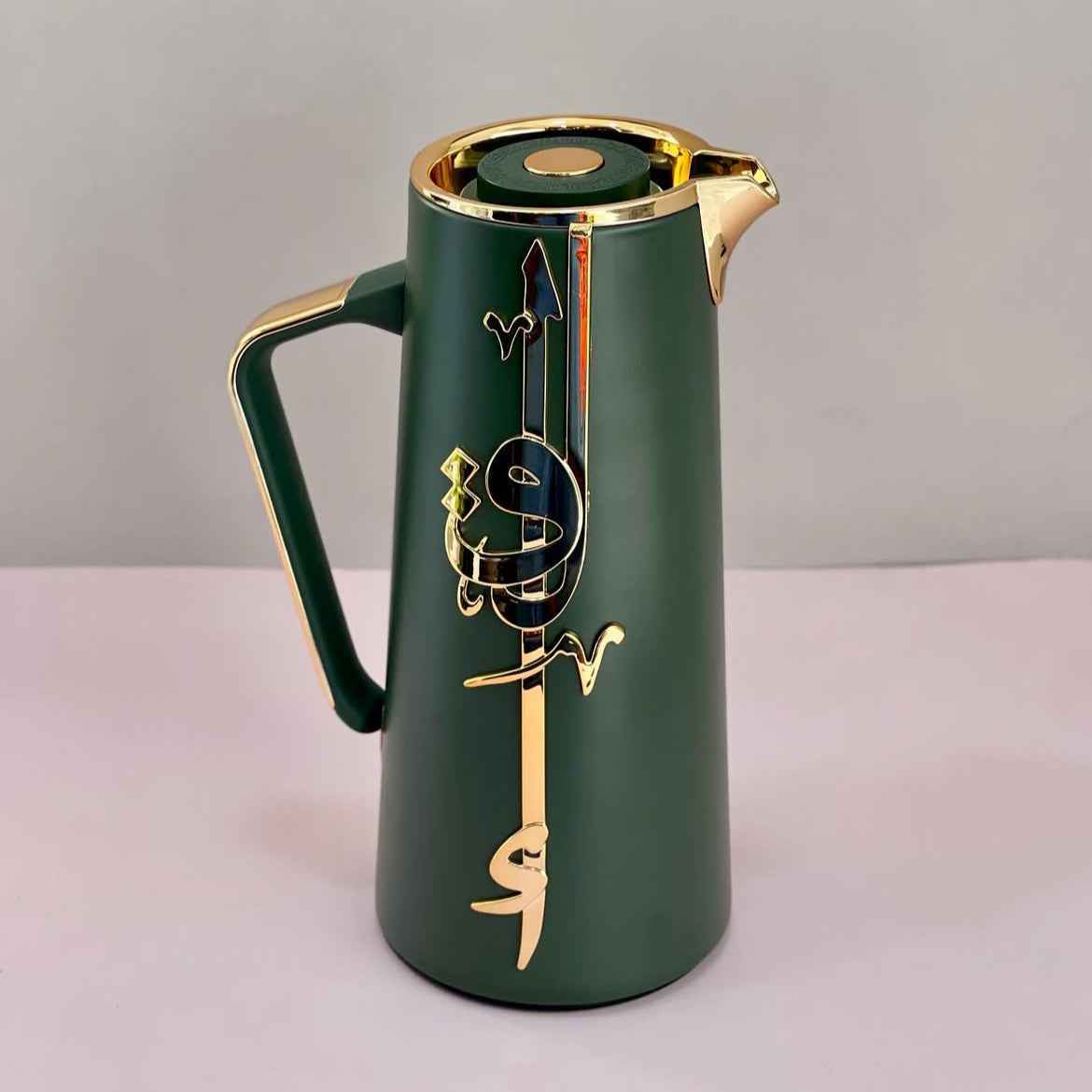 Otantik Home olive green vacuum flask with gold accents and decorative Arabic calligraphy design