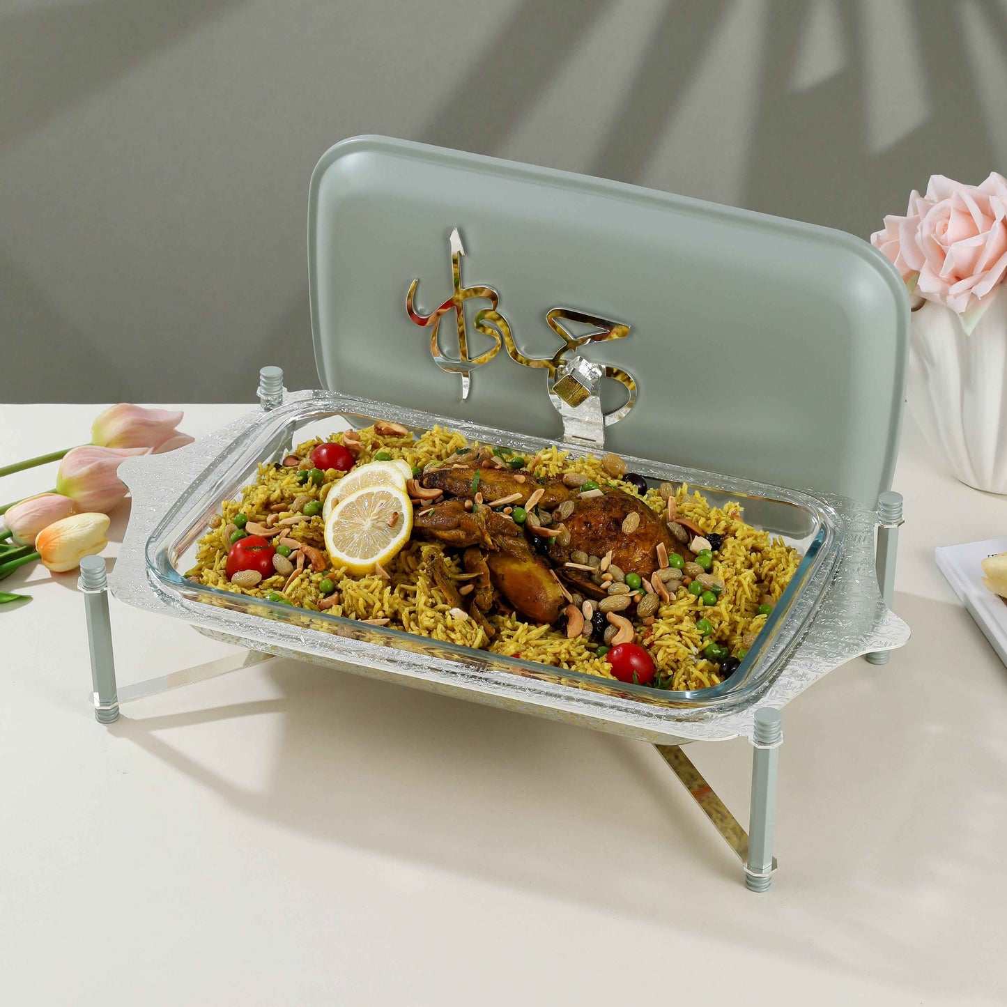 Otantik Home pyrex chafer with cover holding rice and chicken on a white table