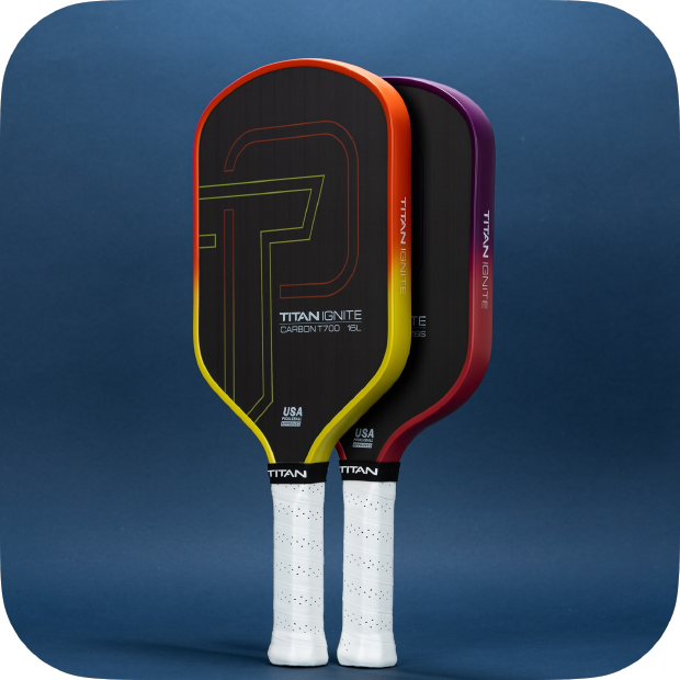 Titan Ignite 16L pickleball paddle by Titan Pickleball with black carbon surface and colorful edge design