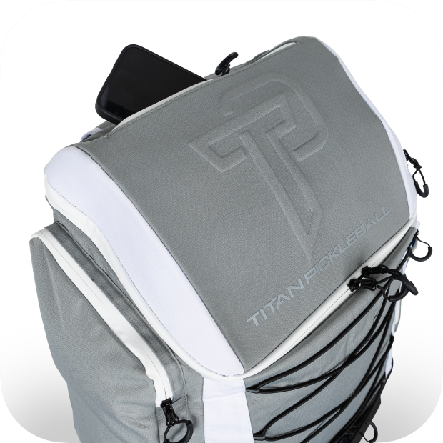 Gray and white Titan Pickleball Backpack with large logo and multiple compartments for gear storage