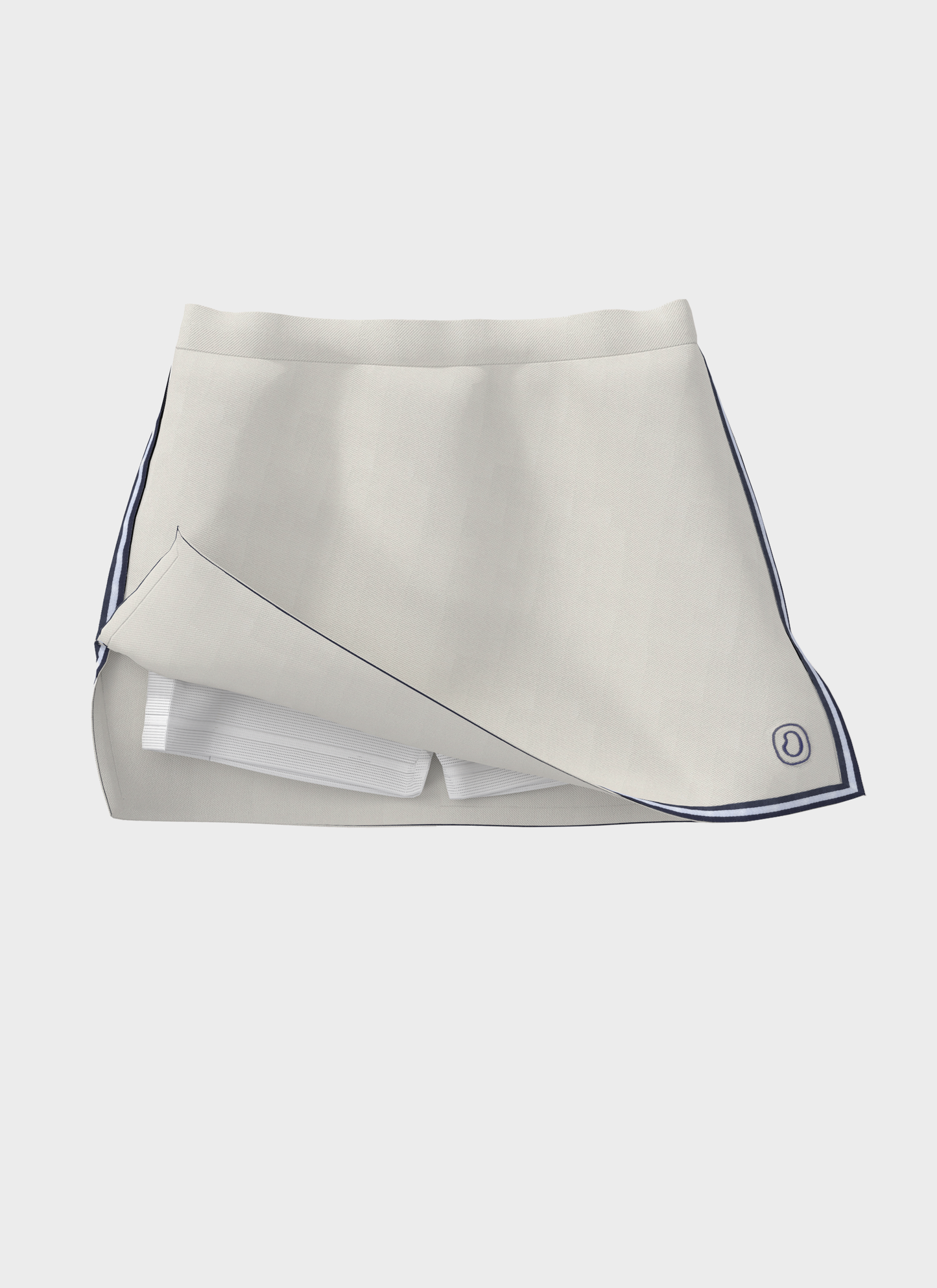 Ondine beige UPF 50 athletic skort with navy trim and built-in white shorts