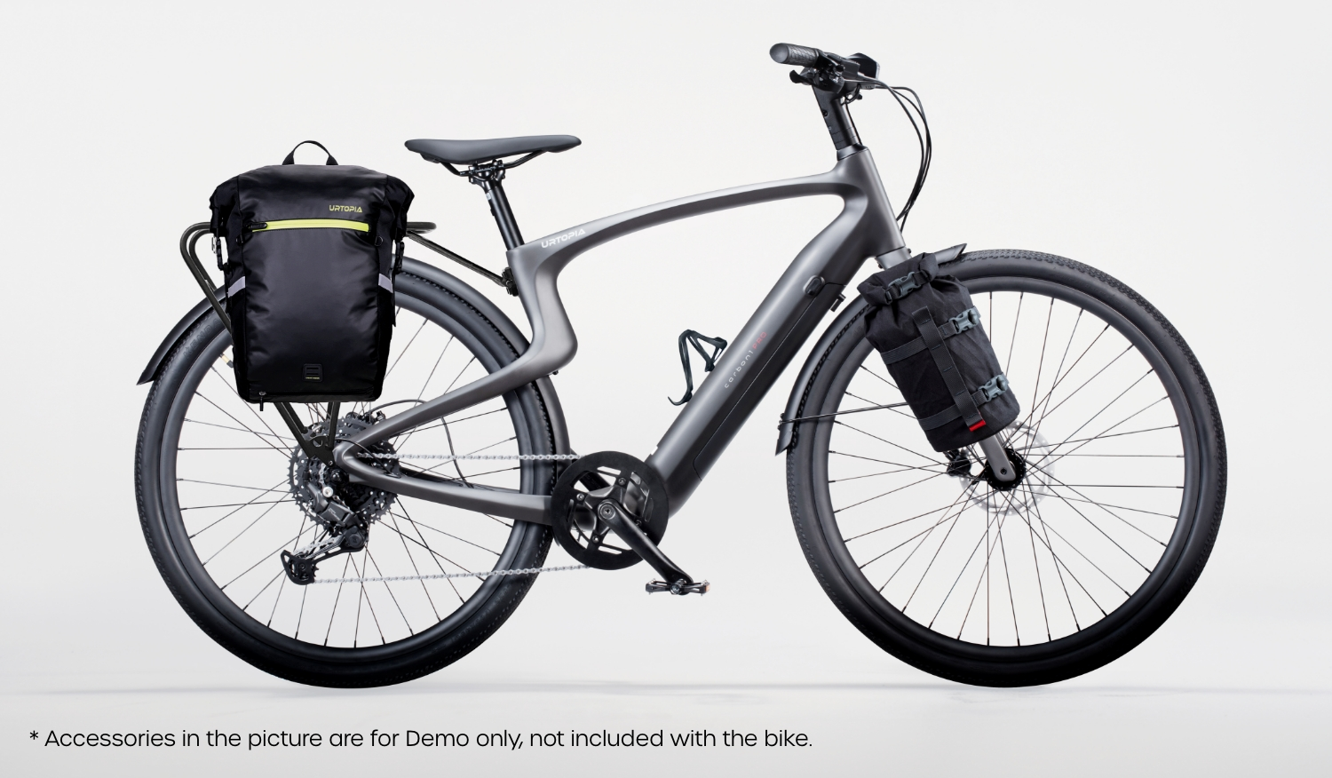 Rex E-Bikes Urtopia Carbon 1 Pro e-bike in gray with sleek frame and attached black bags