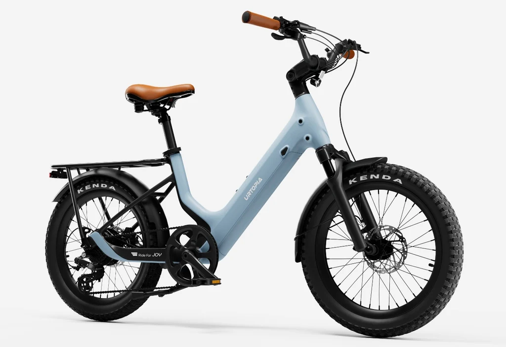 Rex E-Bikes Urtopia Joy Carbon E-Bike in light blue with brown seat and fat tires